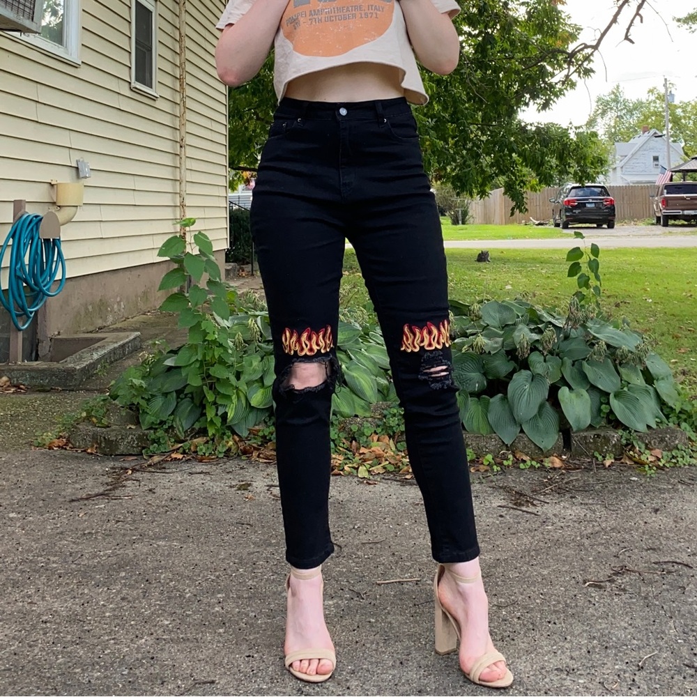 Black jeans with flames and ripped detailing